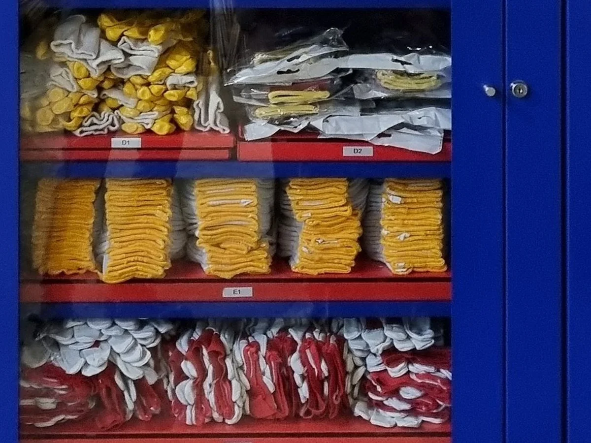 Shelves of work gloves in an Inostorage cabinet